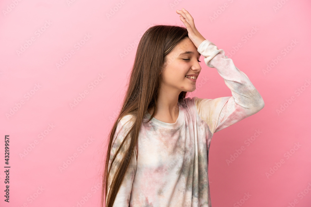 Fototapeta premium Little girl over isolated pink background has realized something and intending the solution