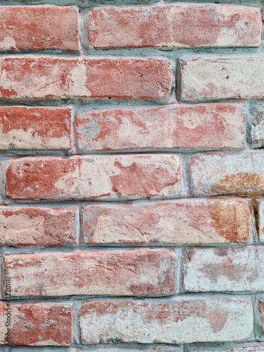 Texture of old red bricks on the wall, background picture. vertical format