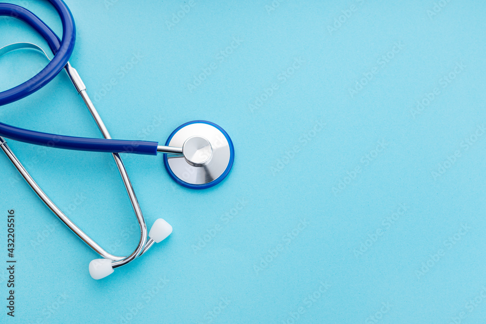 Stethoscope on blue background. Medical concept background. Copy space. Top view Stethoscope on blue background. Medical concept background. Copy space. Top view