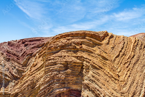 Anticline layers in a hill in the Mojave Desert photo