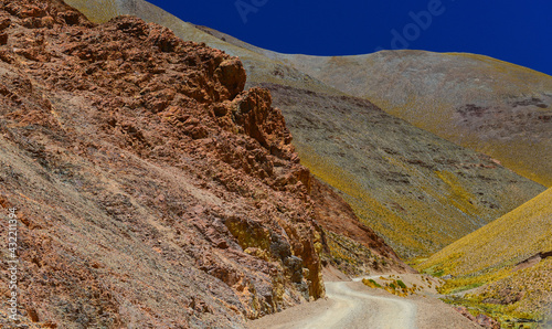 Rough and colorful road on the way from La Poma to the Abra del Acay mountain pass (4.972m), the highest point in Argentina's National Route 40 (RN40), Salta, northwest Argentina photo