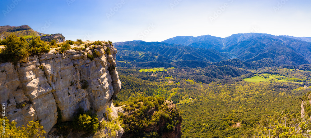 Panoramic view from Tavertet, the Avent cliffs, with the river Ter following its course towards the Susqueda reservoir in the background. Collsacabra, Osona, Catalonia, Spain