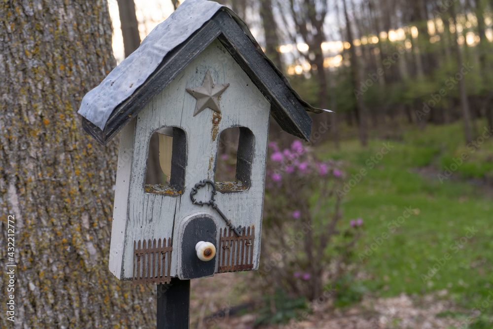 Gray Bird House in Garden