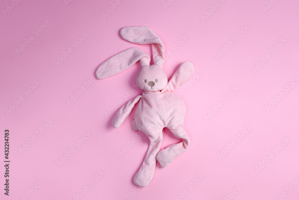 top view of cute pink plush rabbit dancing on pink background with copy space - obrazy, fototapety, plakaty 
