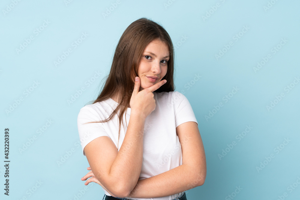 Teenager caucasian girl isolated on blue background happy and smiling Teenager caucasian girl isolated on blue background happy and smiling