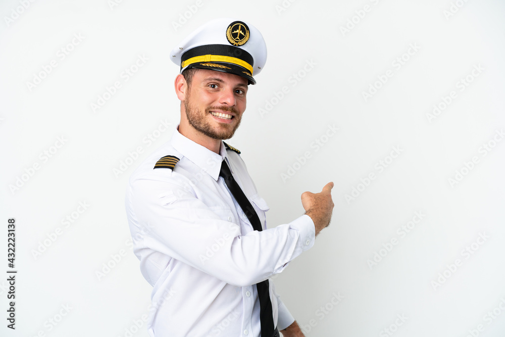 Airplane Brazilian pilot isolated on white background pointing back Airplane Brazilian pilot isolated on white background pointing back