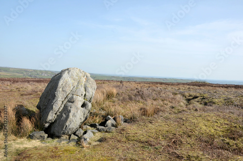 large old boulder or standing stone on midgley moor in west yorkshire known as robin hoods penny stone © Philip J Openshaw 