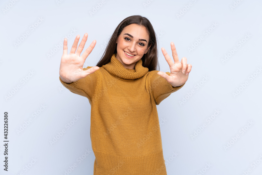 Young caucasian woman isolated on blue background counting eight with fingers Young caucasian woman isolated on blue background counting eight with fingers