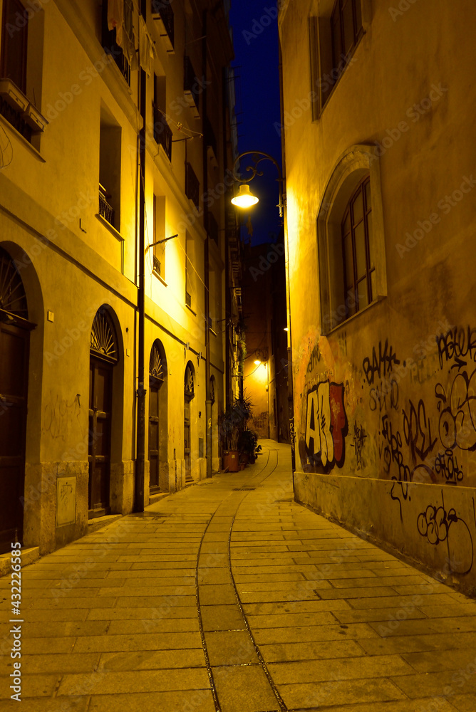 The one of many deserted narrow cozy streets in Cagliari, Sardinia, Italy.