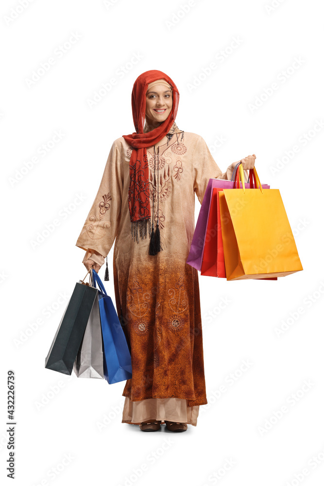 Full length portrait of a muslim woman with shopping bags