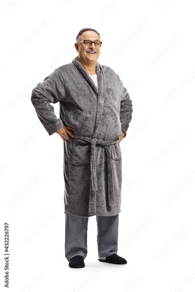Full length portrait of a mature man in pajamas and a robe Full length portrait of a mature man in pajamas and a robe