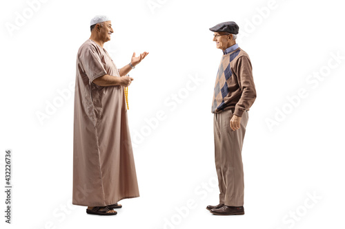 Full length profile shot of a muslim man talking to an elderly man