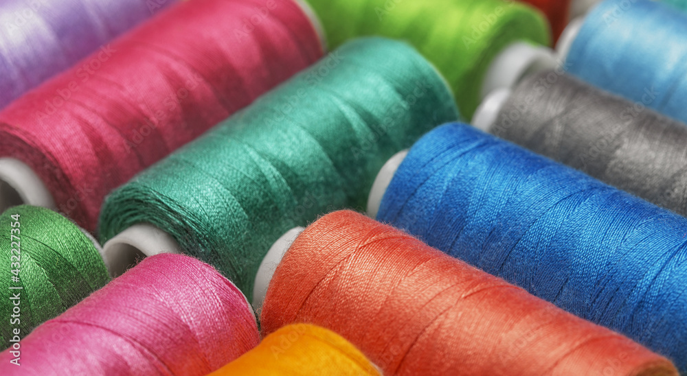 Colored threads on bobbins blue, green ,red. Colored threads on bobbins blue, green ,red.