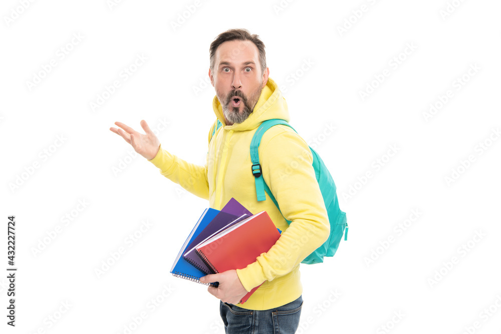 caucasian man in yellow hoody planning his work. literature education for adult. guy hold workbook. caucasian man in yellow hoody planning his work. literature education for adult. guy hold workbook.