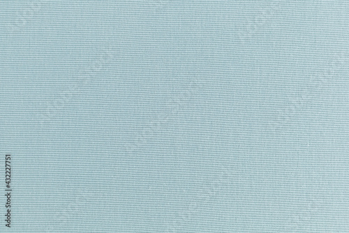 smooth surface of soft knitted fabric for sewing clothes in turquoise color, background, texture