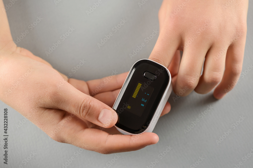 Measuring the amount of oxygen in blood with a pulse oximeter. Measuring the amount of oxygen in blood with a pulse oximeter.