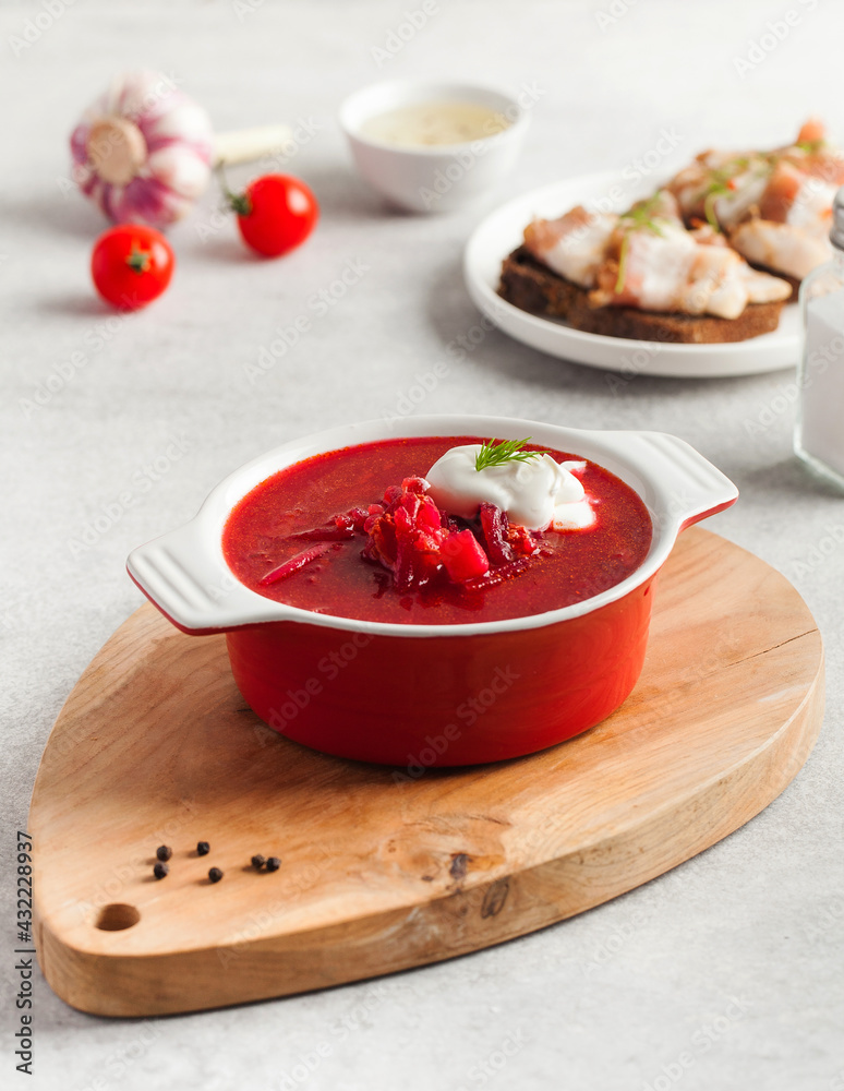 Delicious fresh red borscht, dark bread with lard and salt n kitchen table. Delicious fresh red borscht, dark bread with lard and salt n kitchen table.