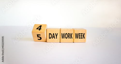 4 or 5 day work week symbol. Turned the cube and changed words '5 day work week' to '4 day work week'. Beautiful white background. Copy space. Business and 4 or 5 day work week concept. photo