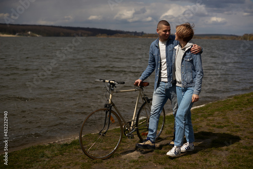 Couple on a bicycle walking
