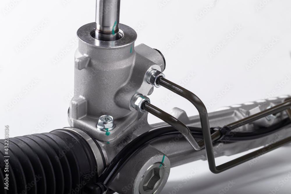 Obraz premium Studio lighting. on a white background, the steering rack of the car. New part.