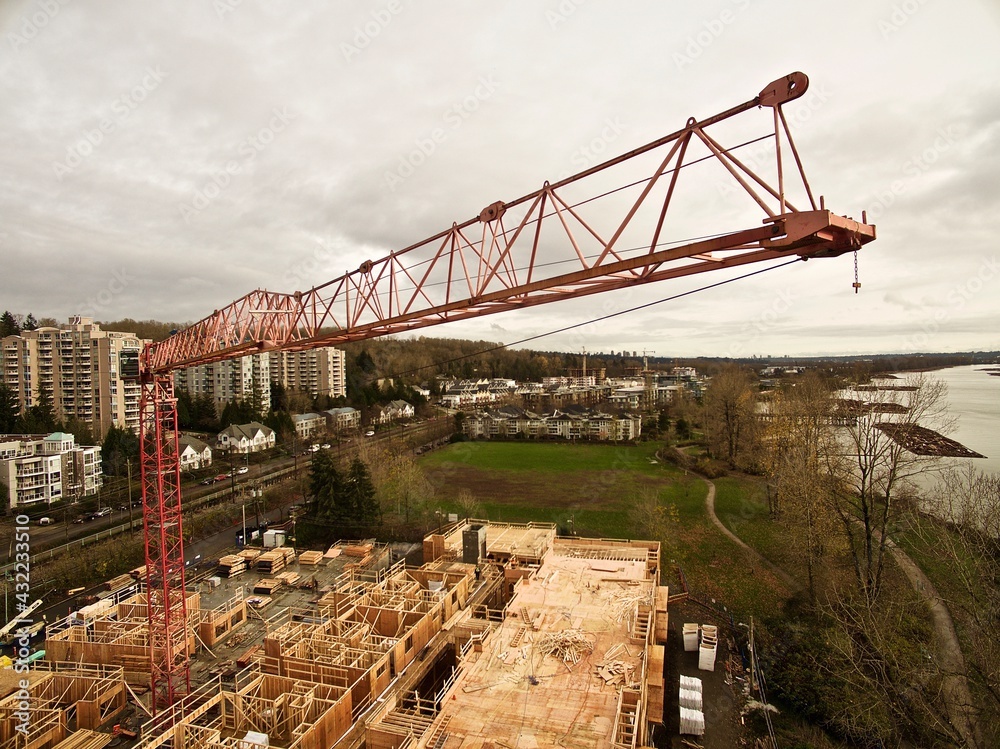 Crane on Top of a Wood Frame Condo Construction Project Crane on Top of a Wood Frame Condo Construction Project