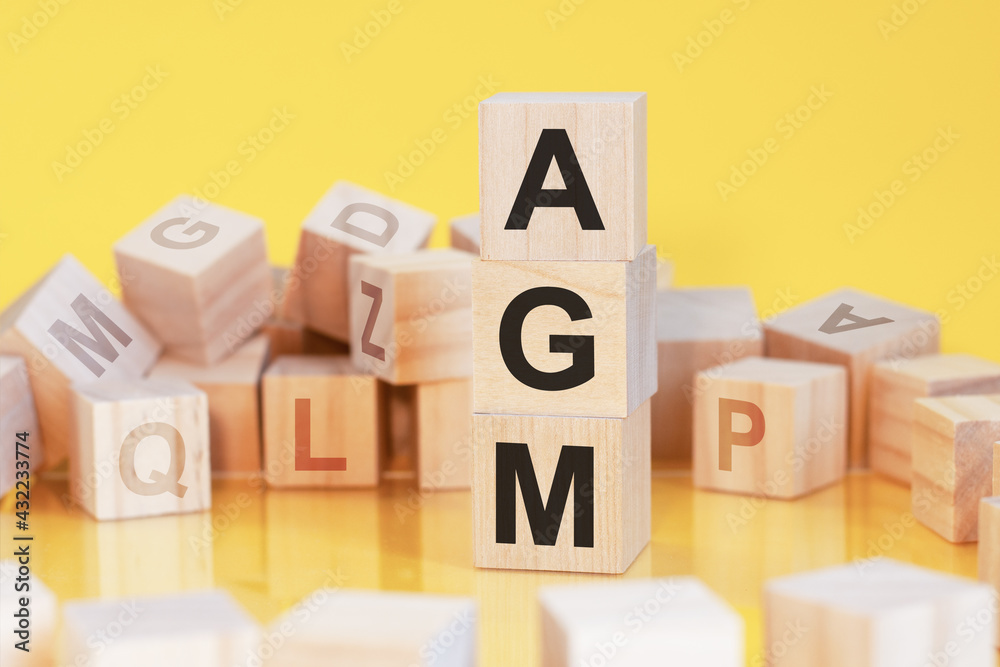 word agm from wooden blocks with letters, concept word agm from wooden blocks with letters, concept
