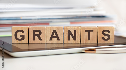 the word grants is written on wooden cubes, concept photo