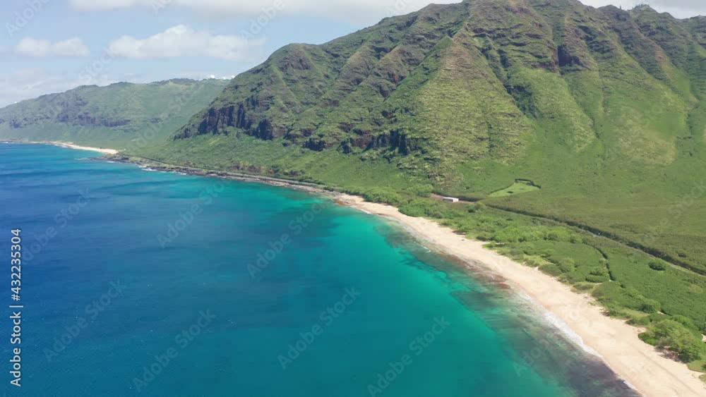 Aerial view from above down Drone shot. Beautiful tropical beach sea with white sand. Top view. Empty and clean beach in summer season on Oahu Hawaii Island.