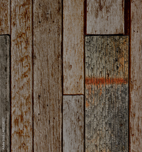 Antique reclaimed wood background with aged boards lined up. Wooden floor planks with grain and texture.