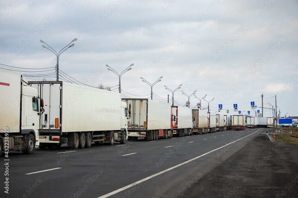 a long traffic jam of many trucks at the border , a long wait for customs checks between States due to the coronavirus epidemic, increased sanitary inspection of cargo transport