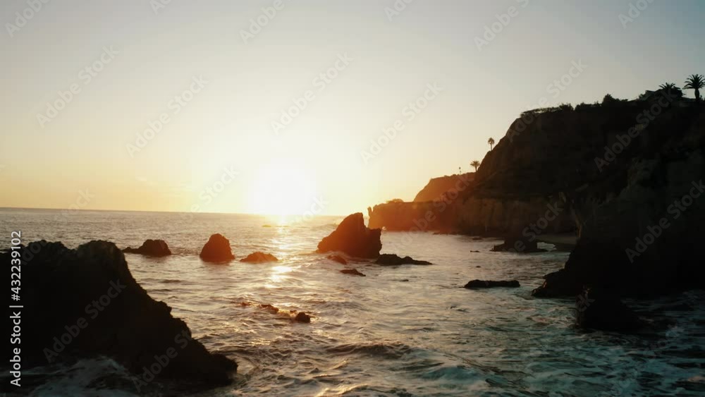malibu california west coast cliffs beach shore waves sunset backlight sun silhouette aerial drone 4k