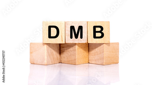 DMB letters on wooden cubes isolated on a white background