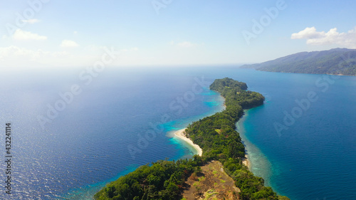 Big Liguid Island with beautiful beach, palm trees by turquoise water view from above. Big Cruz Island, Philippines, Samal.