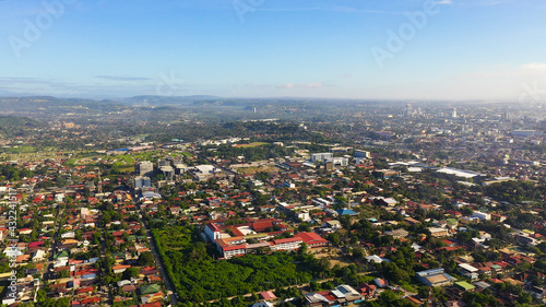 Davao city with modern buildings, business centers on the island of Mindanao view from above. Davao del Sur, Philippines.