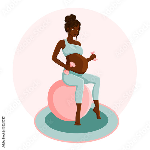 Black pregnant woman goes in for sports. Beautiful woman sits on a ball and holds dumbbells.