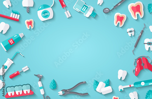 Teeth and dentist tools on blue background