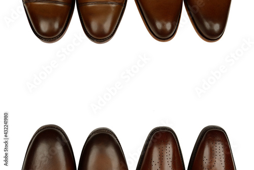 Four men's brown oxford fashion shoes isolated on white background with the space for your text.