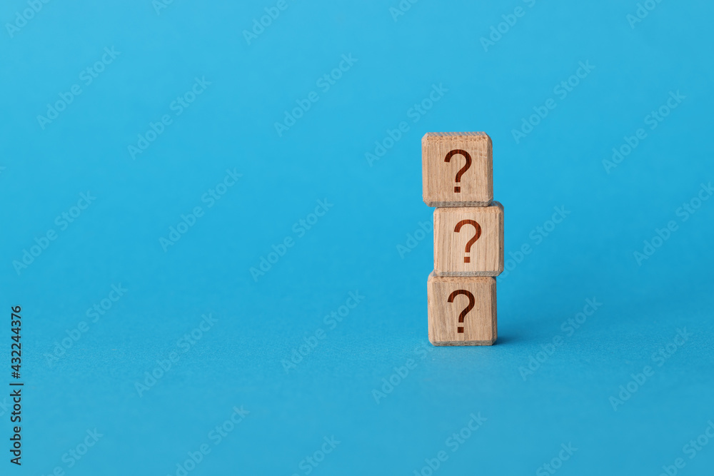 On blue background, there is pyramid of cubes with question mark On blue background, there is pyramid of cubes with question mark