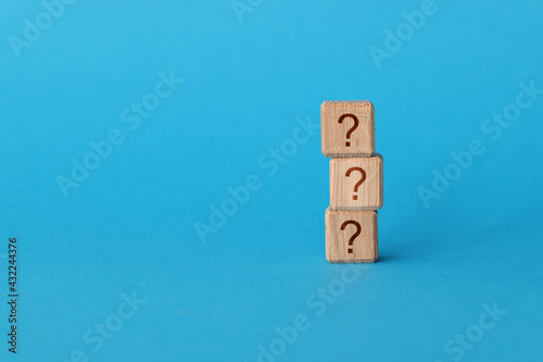 On blue background, there is pyramid of cubes with question mark