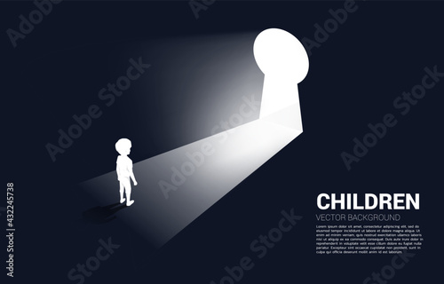silhouette of kid ready to move out to key hole door. Concept of children education and learning.