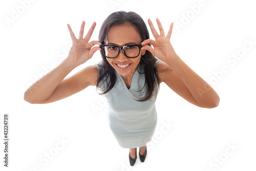 Asian caucasian businesswoman holding her eyeglasses with open palms smiling happy and looking at camera. Dynamic fun high angle view. Isolated on white background in full body. photo