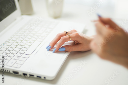 Woman typing on laptop keyboard in the office. Close up woman hands writing on laptop computer keyboard. home, freelancer, project, writing, communication, digital, monitor, notebook, student creative
