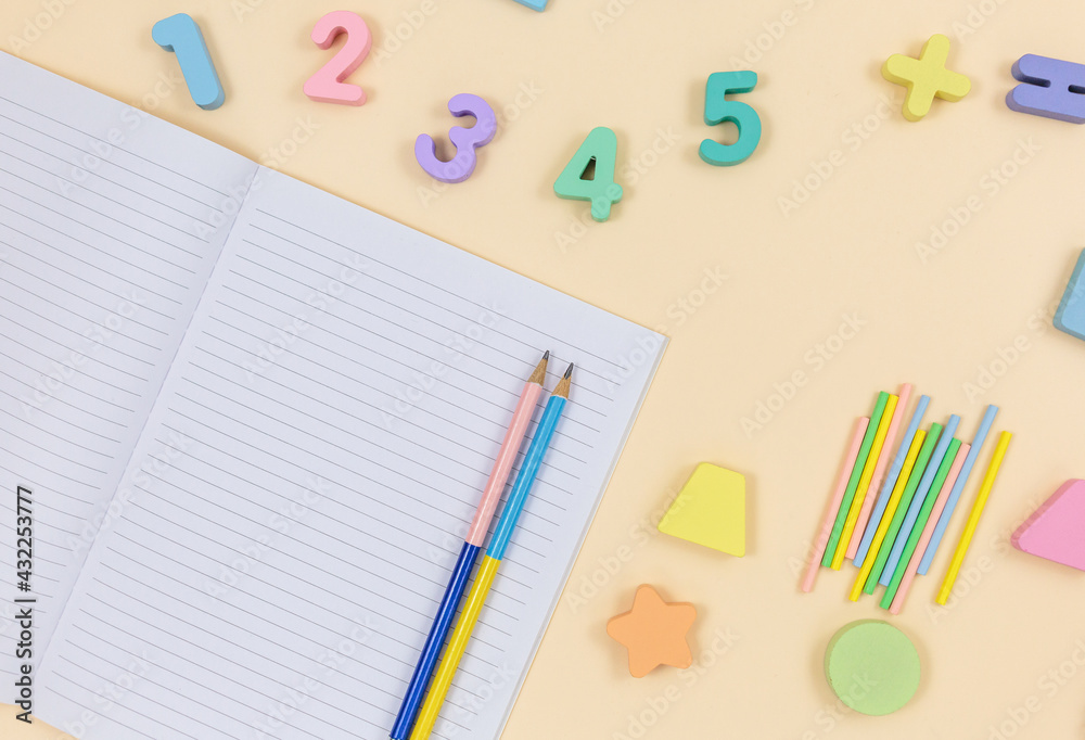 Multicolored wooden fractions, cubes, numbers on wooden table. Trendy puzzle toys. Geometric shapes. Back to school. Educational toys for kindergarten, preschool or daycare. Close up. Multicolored wooden fractions, cubes, numbers on wooden table. Trendy puzzle toys. Geometric shapes. Back to school. Educational toys for kindergarten, preschool or daycare. Close up.