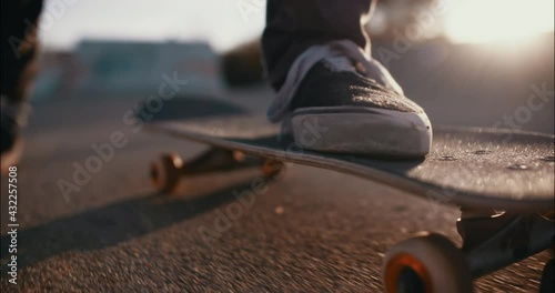 detail of foot skating on a skateboard photo