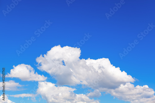Fluffy white clouds on the blue sky 