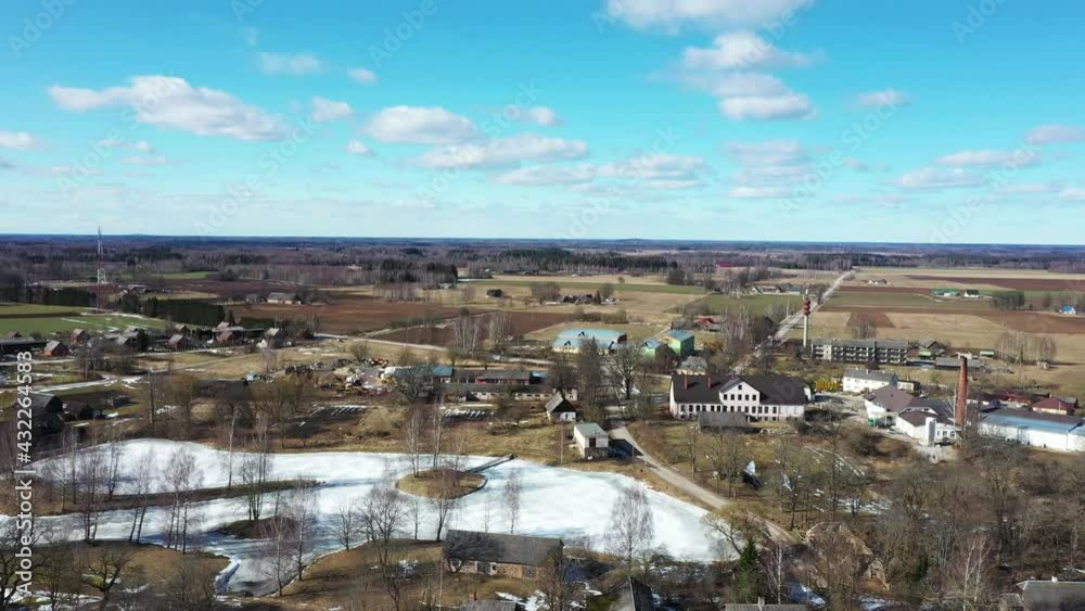 Aerial birds eye view flying over rural town in summer, wide angle Aerial birds eye view flying over rural town in summer, wide angle