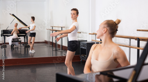 Fototapeta Naklejka Na Ścianę i Meble -  Female choreographer teaches young dancer in ballet studio High quality photo