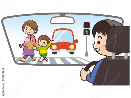 車内から横断歩道を渡る親子を確認する男性　交通安全