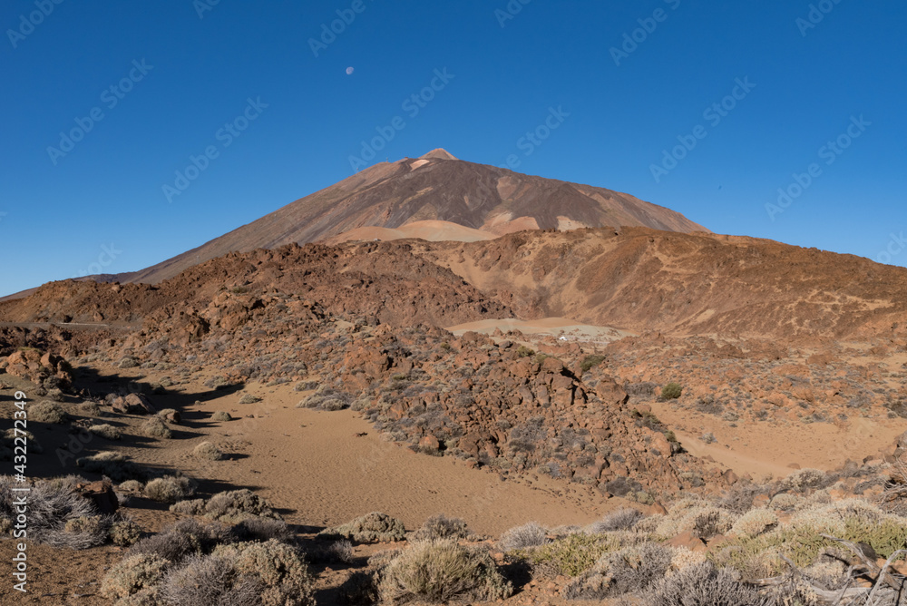 Martian landscape on the eastern slopes of Montana Blanca Mirador las Minas de San Jose with Teide mount at background. Teide National park, Tenerife, Canary islands, Spain
