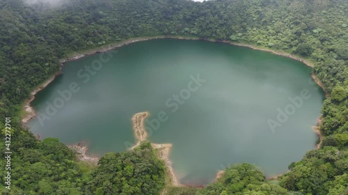 Calm Lake Surrounded By Dense Forest - Lake Danao Natural Park Near Ormoc City In Leyte, Philippines. - Aerial Orbit photo